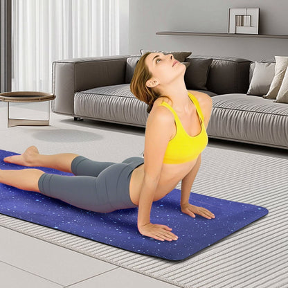 Blue printed yoga mat used for floor exercise, non-slip surface visible