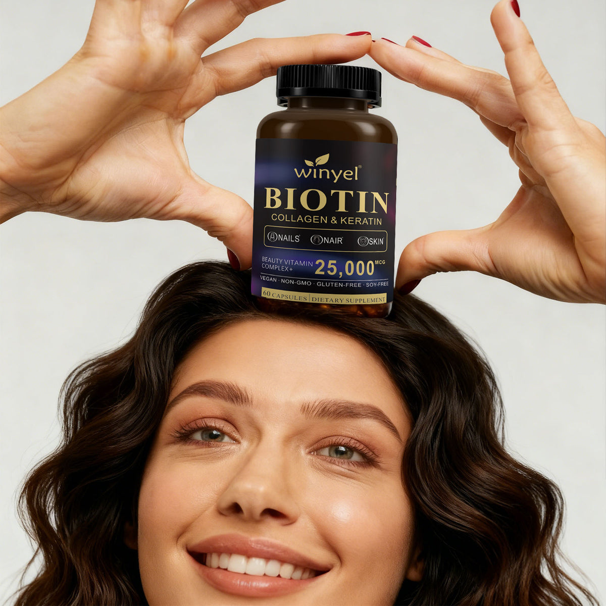 Winyel biotin collagen keratin supplement bottle with hands above hair