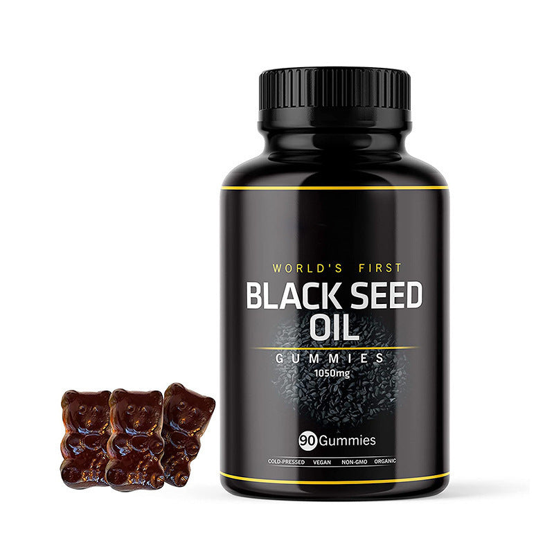 Black seed oil gummies supplement bottle with front label and dark gummy bears