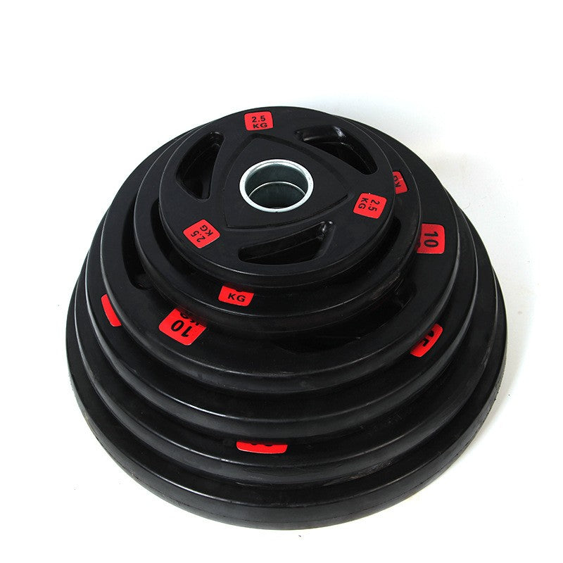 Black 2.5 kg barbell weight disk with central metal bushing and red KG markings