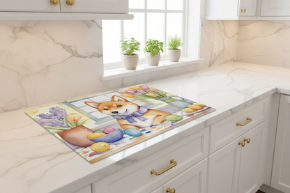 Glass cutting board with Shiba Inu and Easter eggs illustration on a countertop